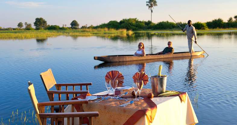 The Okavango Delta is a unique inland delta ecosystem offering world-class boat safaris in Botswana. Travelers can navigate its winding channels, lagoons, and papyrus swamps using traditional mokoros (dugout canoes) or motorized boats, providing unparalleled access to remote wildlife areas.
