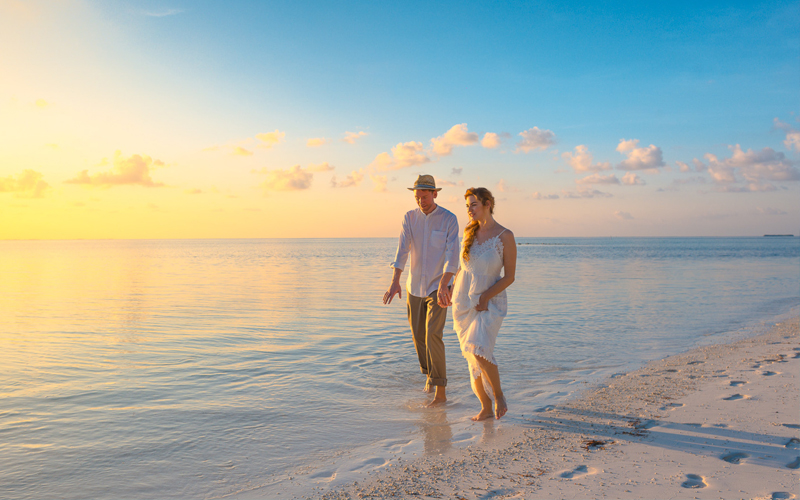 Couple enjoying cool weather at Zanzibar water shores