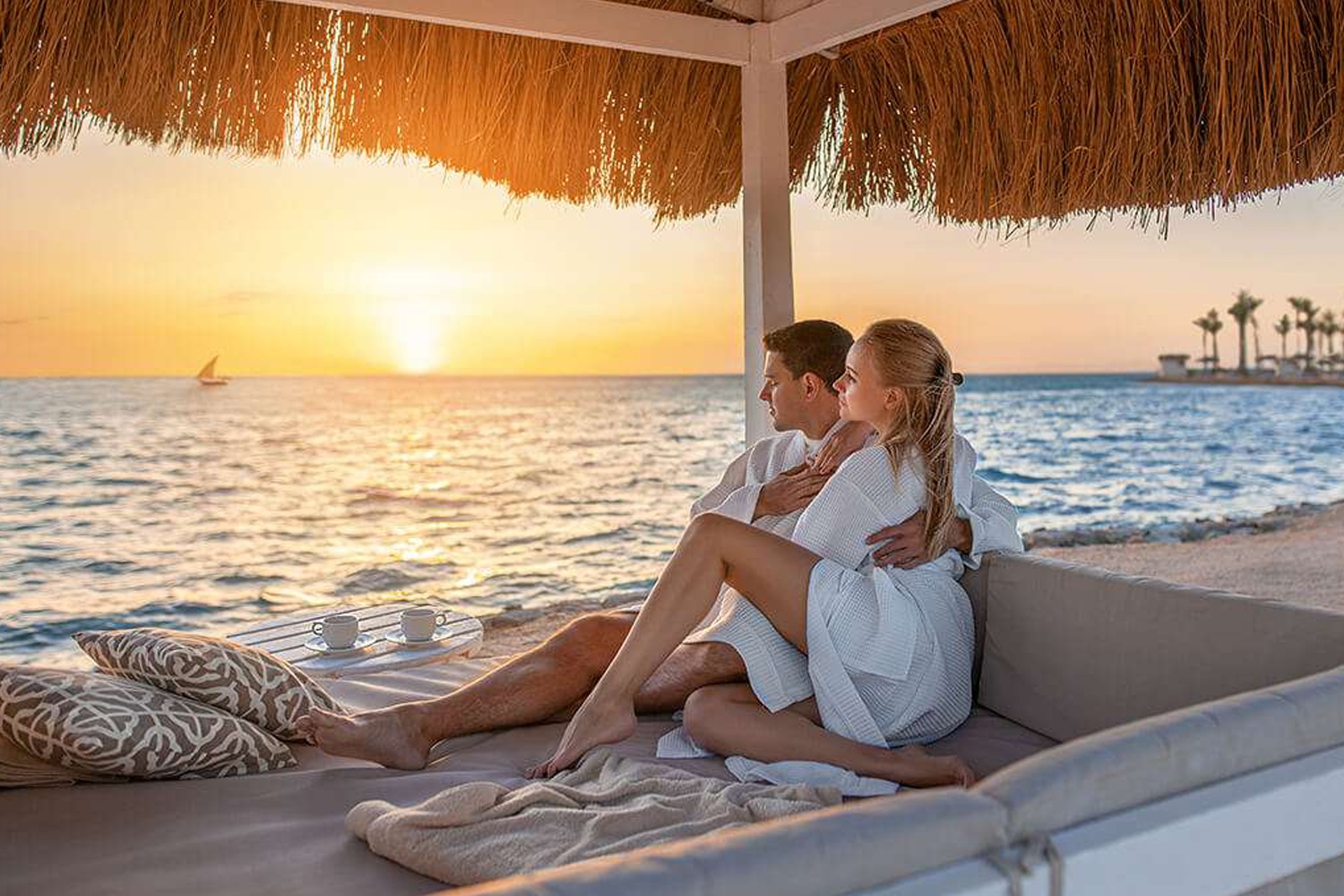 Couple watching sunset during Serengeti and Zanzibar beach holiday