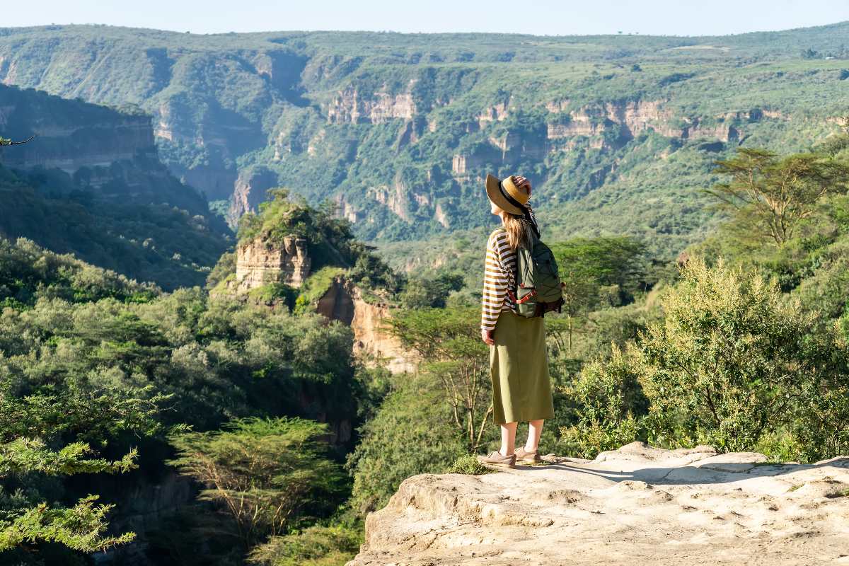 Tourist viewing the natural landscape of Hell's Gate National Park