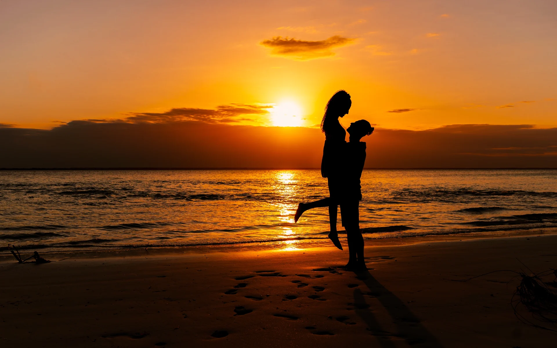 Couple watching sunset during Zanzibar honeymoon