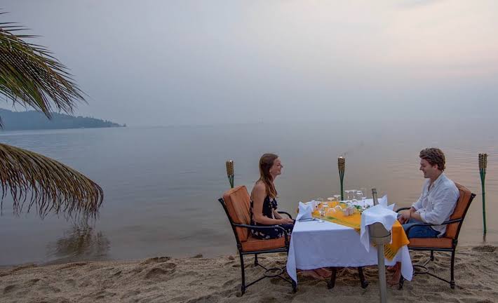 Couple having dinner at Lake Kivu