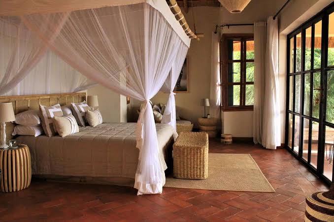 Luxury bed setup at Elephant Plains Lodge accommodation
